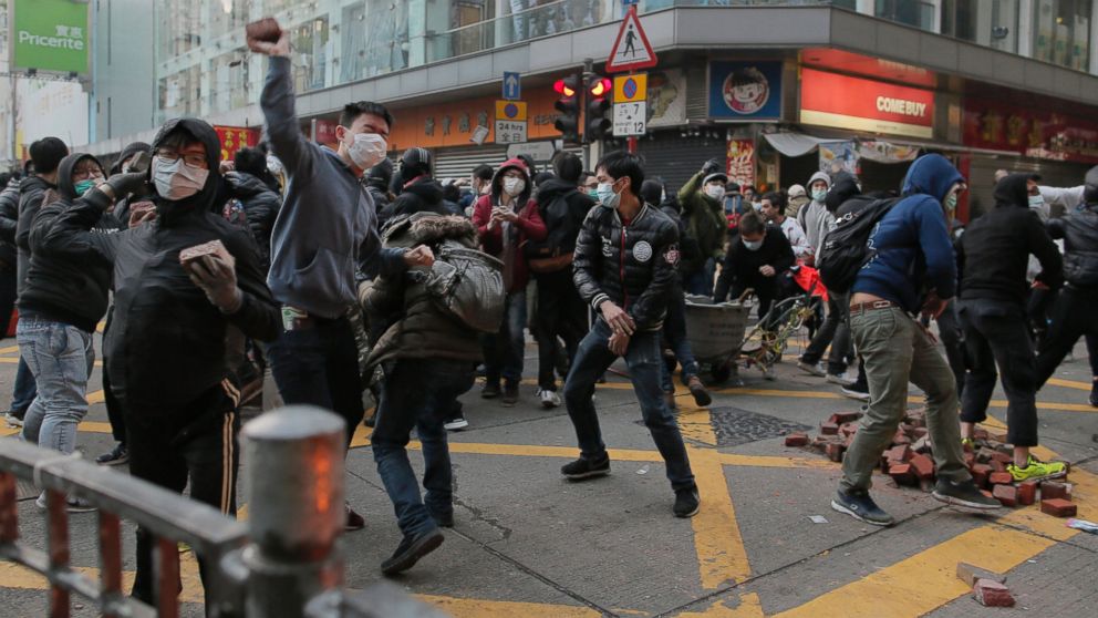 PHOTO: Rioters throw bricks at police in Mong Kok district of Hong Kong, Feb. 9, 2016.
