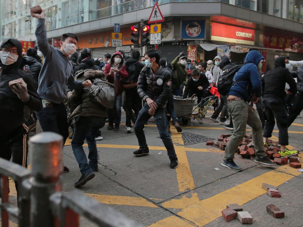 PHOTO: Rioters throw bricks at police in Mong Kok district of Hong Kong, Feb. 9, 2016.