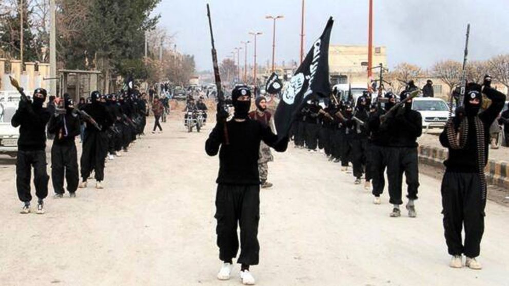 
	This undated file image posted on a militant website on Jan. 14, 2014, shows fighters from the al Qaida-linked Islamic State of Iraq and the Levant (ISIL) marching in Raqqa, Syria.
