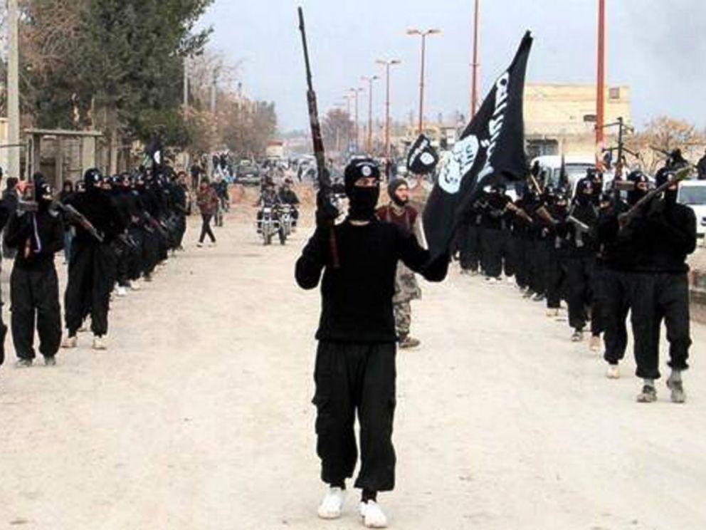 PHOTO: This undated file image posted on a militant website on Jan. 14, 2014, shows fighters from the al Qaida-linked Islamic State of Iraq and the Levant (ISIL) marching in Raqqa, Syria.
