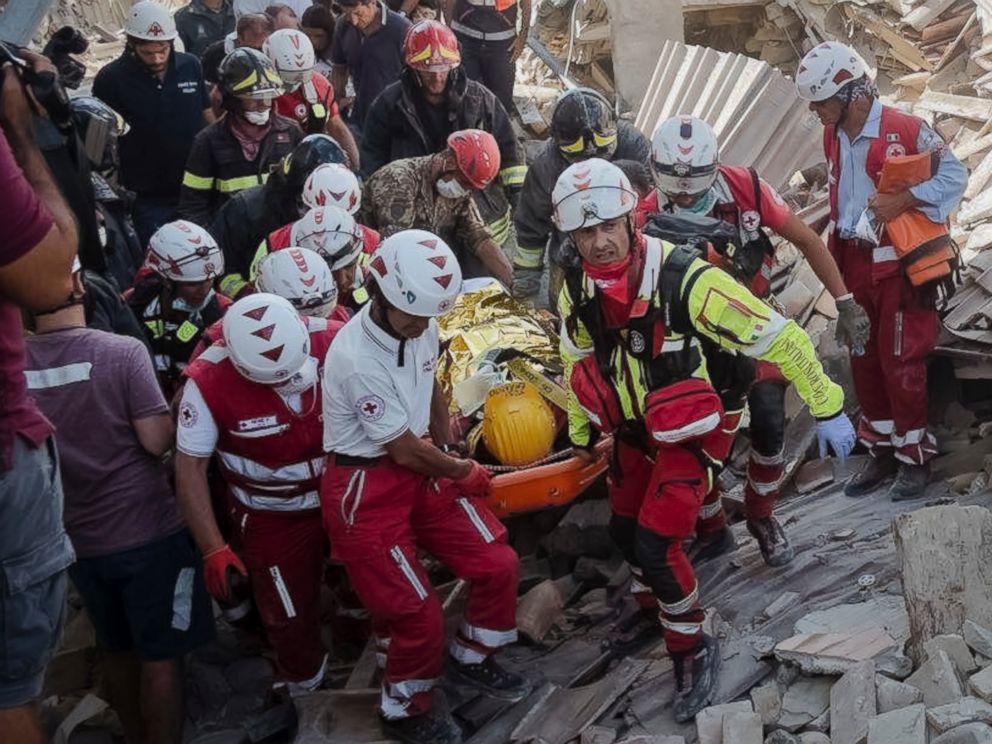 PHOTO: A survivor is pulled out of the rubble in Amatrice, central Italy, where a 6.1 earthquake struck just after 3:30 a.m., Wednesday, Aug. 24, 2016.