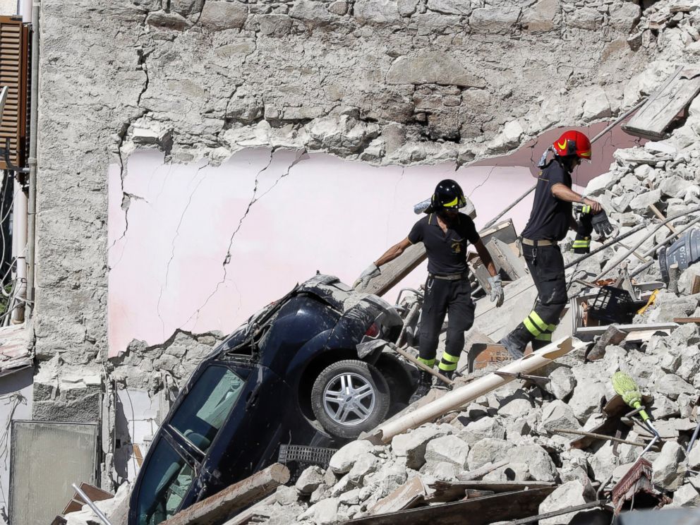 PHOTO: Rescuers make their way through destroyed houses following Wednesdays earthquake in Pescara Del Tronto, Italy, Thursday, Aug. 25, 2016.