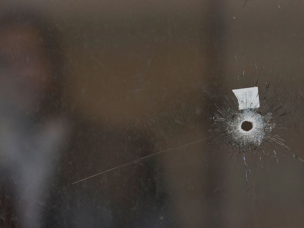 PHOTO: A bullet hole and forensic evidence are seen in side the Synagogue at the site of an attack in Jerusalem, Nov. 18, 2014.