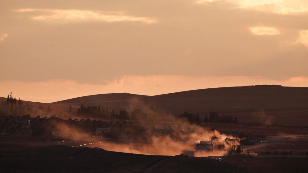 Smoke rises following a strike on the western outskirts of Kobani, Syria, Oct. 19, 2014.