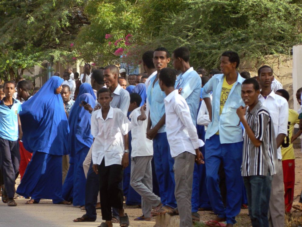 PHOTO: Students gather and watch from a distance outside the Garissa University College after an attack by gunmen, in Garissa, Kenya, April 2, 2015. 