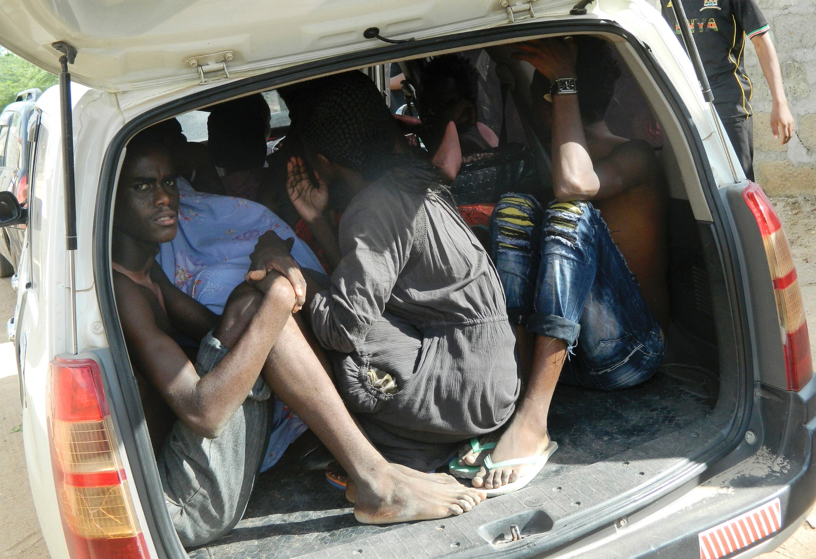 PHOTO: Students of the Garissa University College take shelter in a vehicle after fleeing from an attack by gunmen in Garissa, Kenya, April 2, 2015.