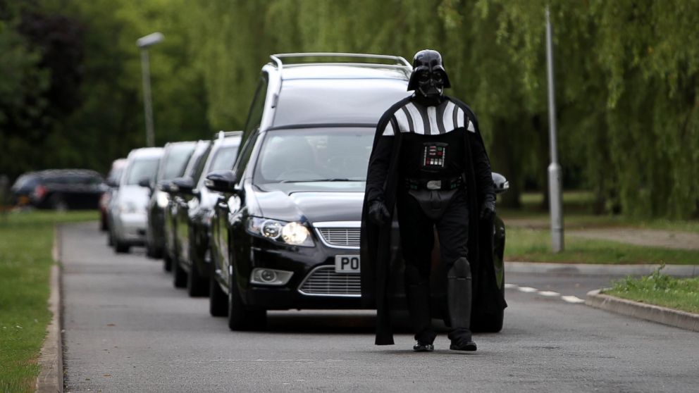 PHOTO: Brett Houghton of Co-op Funeralcare dresses as Star Wars Darth Vader and leads the funeral cortege at the Halloween-themed funeral,  July 15, 2015, of Lorna Johnson,56, at Luton Crematorium, Bedfordshire.