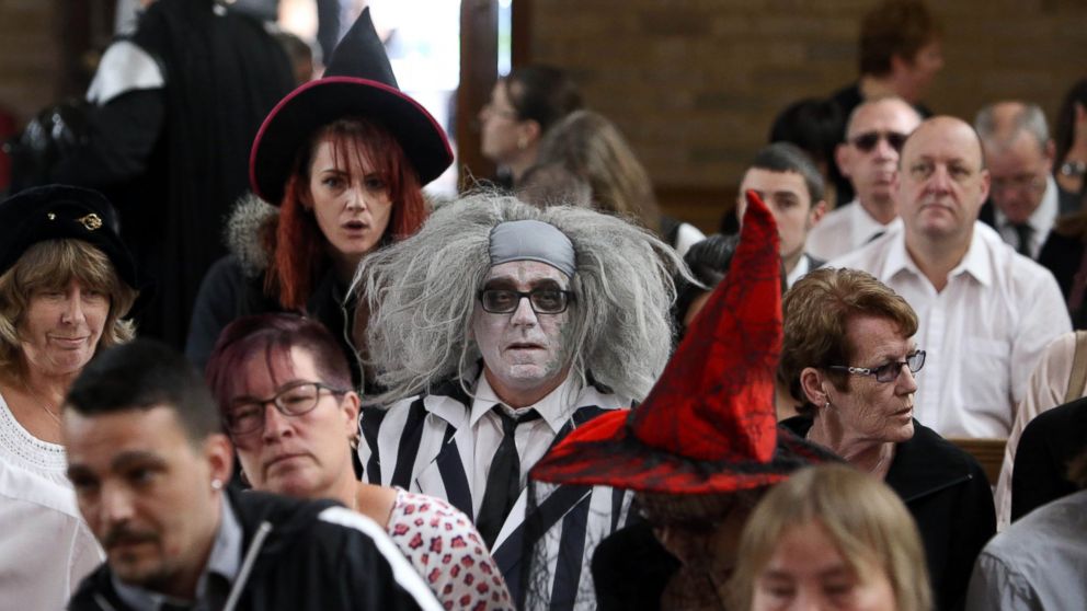 PHOTO: A man dressed as Beetlejuice attends the Halloween-themed funeral, July 15, 2015, of Lorna Johnson,56, at Luton Crematorium, Bedfordshire.