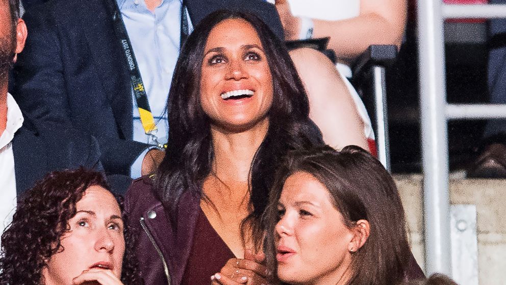 Meghan Markle, top, attends the Invictus Games Opening Ceremonies in Toronto on Saturday, Sept. 23, 2017, a few rows apart from her boyfriend, Britain's Prince Harry. Markle lives in Toronto, but hadn't appeared with Harry since he arrived in the city.