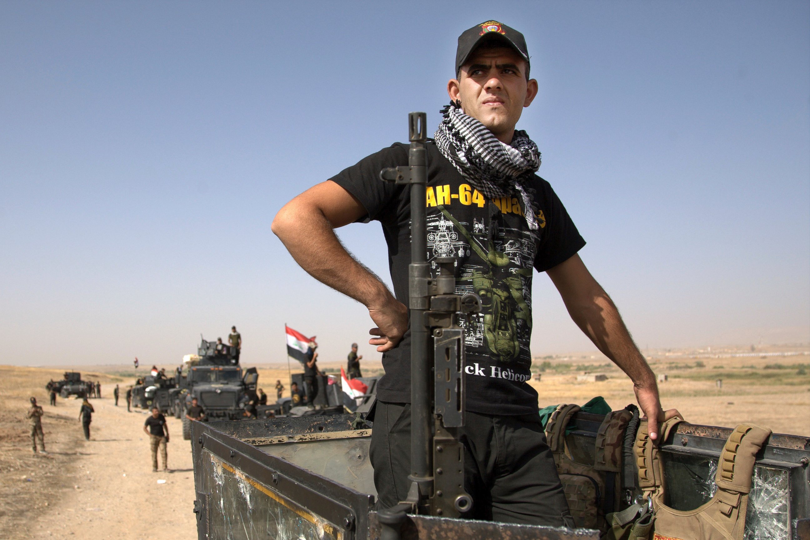 Iraqi special forces soldiers deployed for an offensive to retake Mosul from Islamic State militants prepare to move out from a camp near Khazer, Iraq, on Oct. 14, 2016. 