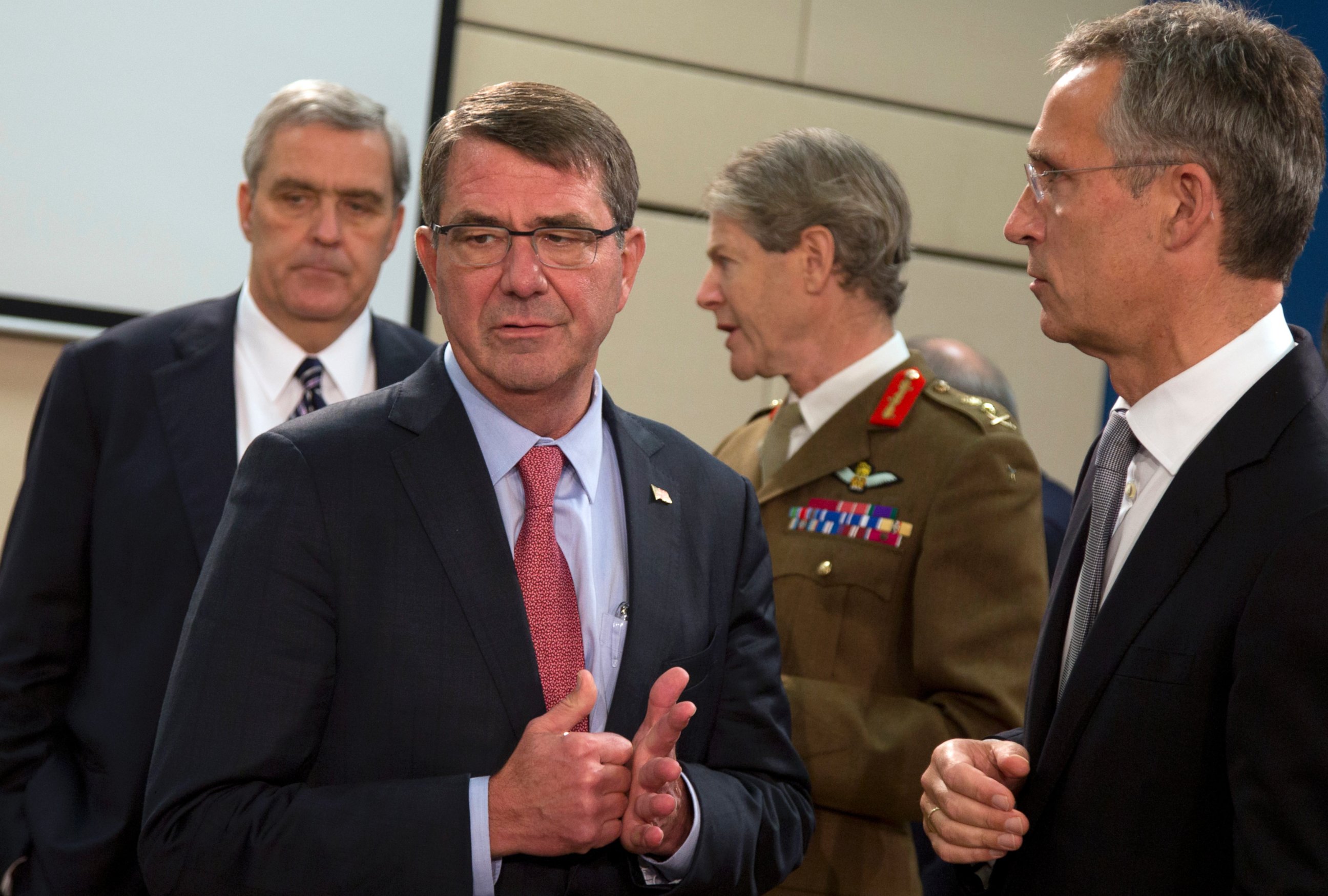 PHOTO: NATO Secretary General Jens Stoltenberg, right, speaks with U.S. Secretary of Defense Ash Carter, second left, during a meeting of the North Atlantic Council at NATO headquarters in Brussels on Oct. 8, 2015. 