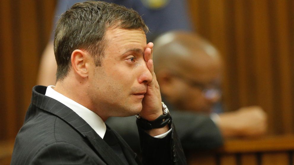 Oscar Pistorius cries in the dock in Pretoria, South Africa, Sept. 11, 2014 as Judge Thokozile Masipa reads notes as she delivers her verdict in Pistorius' murder trial.