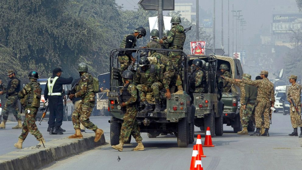 PHOTO: Pakistani army troops arrive to conduct an operation at a school under attack by Taliban gunmen in Peshawar, Pakistan, Dec. 16, 2014.