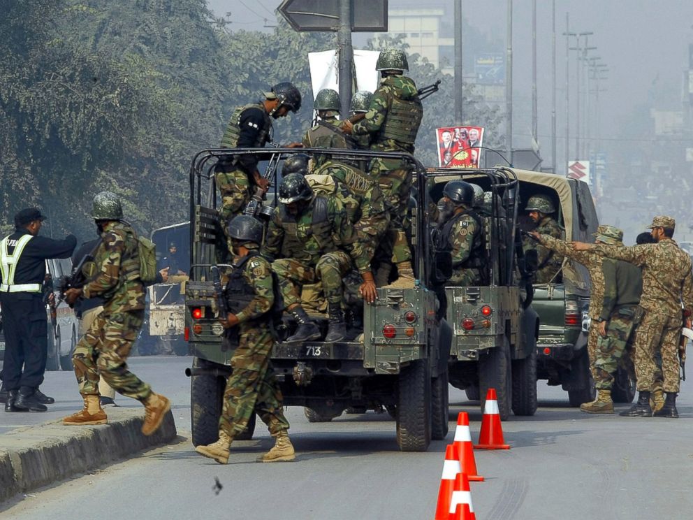 PHOTO: Pakistani army troops arrive to conduct an operation at a school under attack by Taliban gunmen in Peshawar, Pakistan, Dec. 16, 2014.