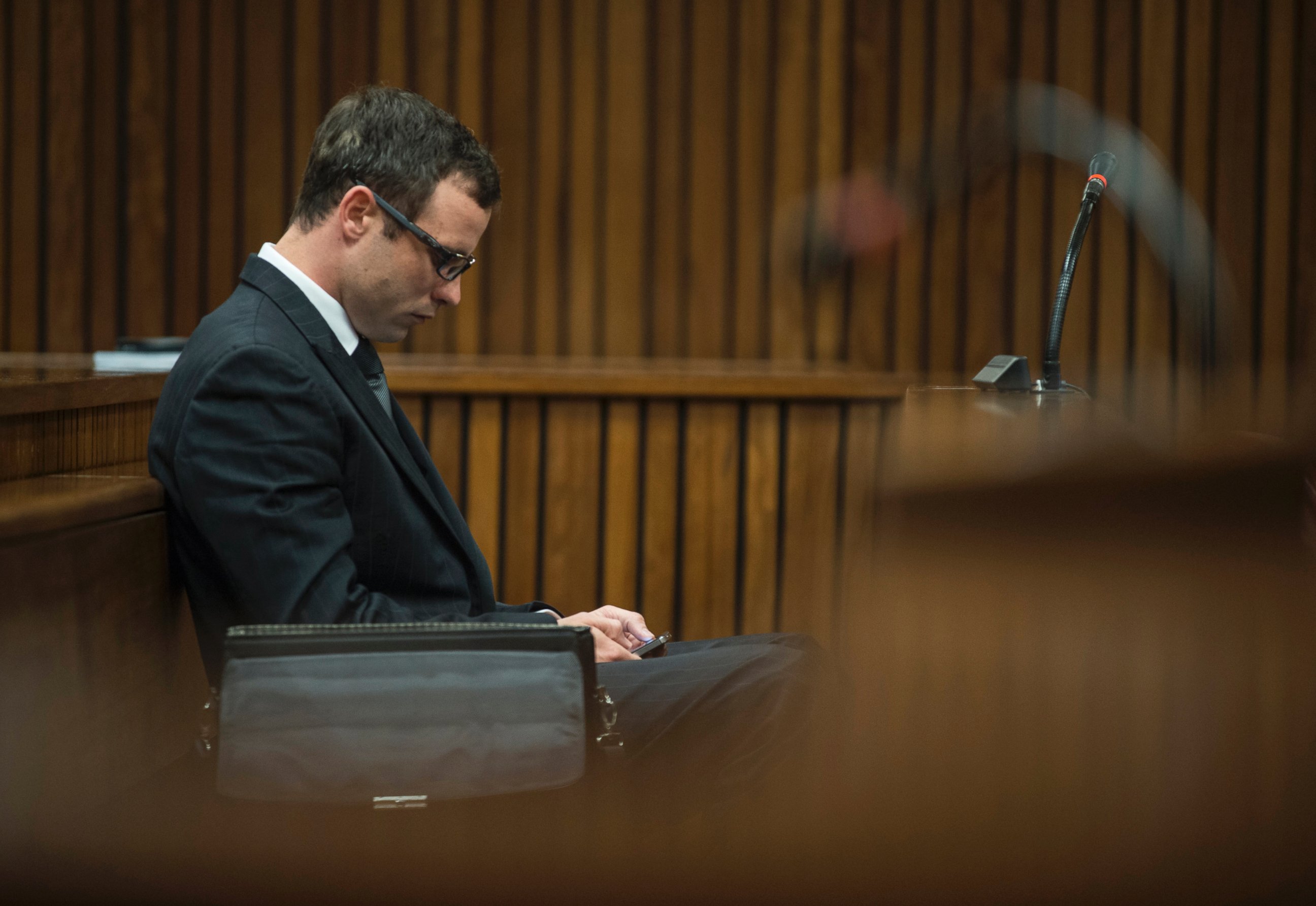 Oscar Pistorius appears in a courtroom at his murder trial in Pretoria, South Africa, Thursday, Aug. 7 2014.