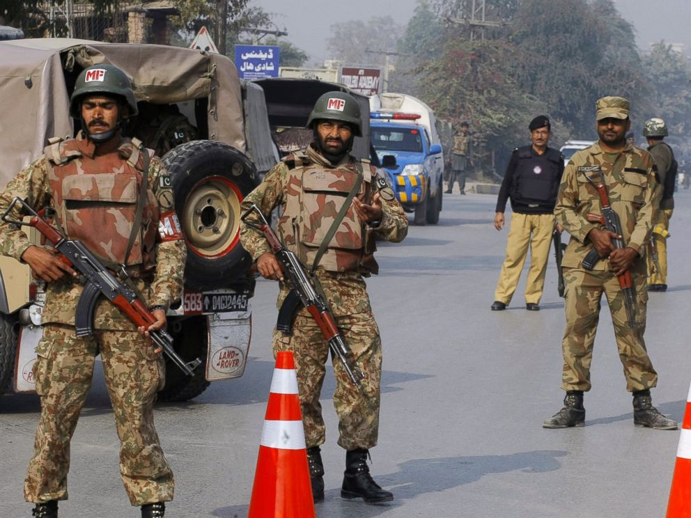 PHOTO: Pakistani army troops cordon off a road leading to a school under attack by Taliban gunmen in Peshawar, Pakistan, Dec. 16, 2014.