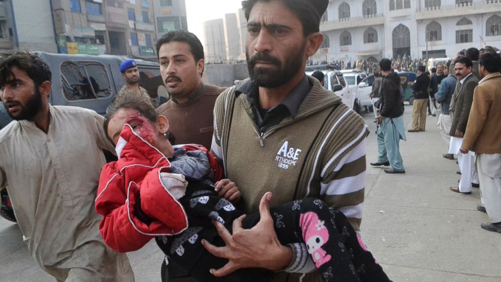 PHOTO: A Pakistani girl, who was injured in a Taliban attack in a school, is rushed to a hospital