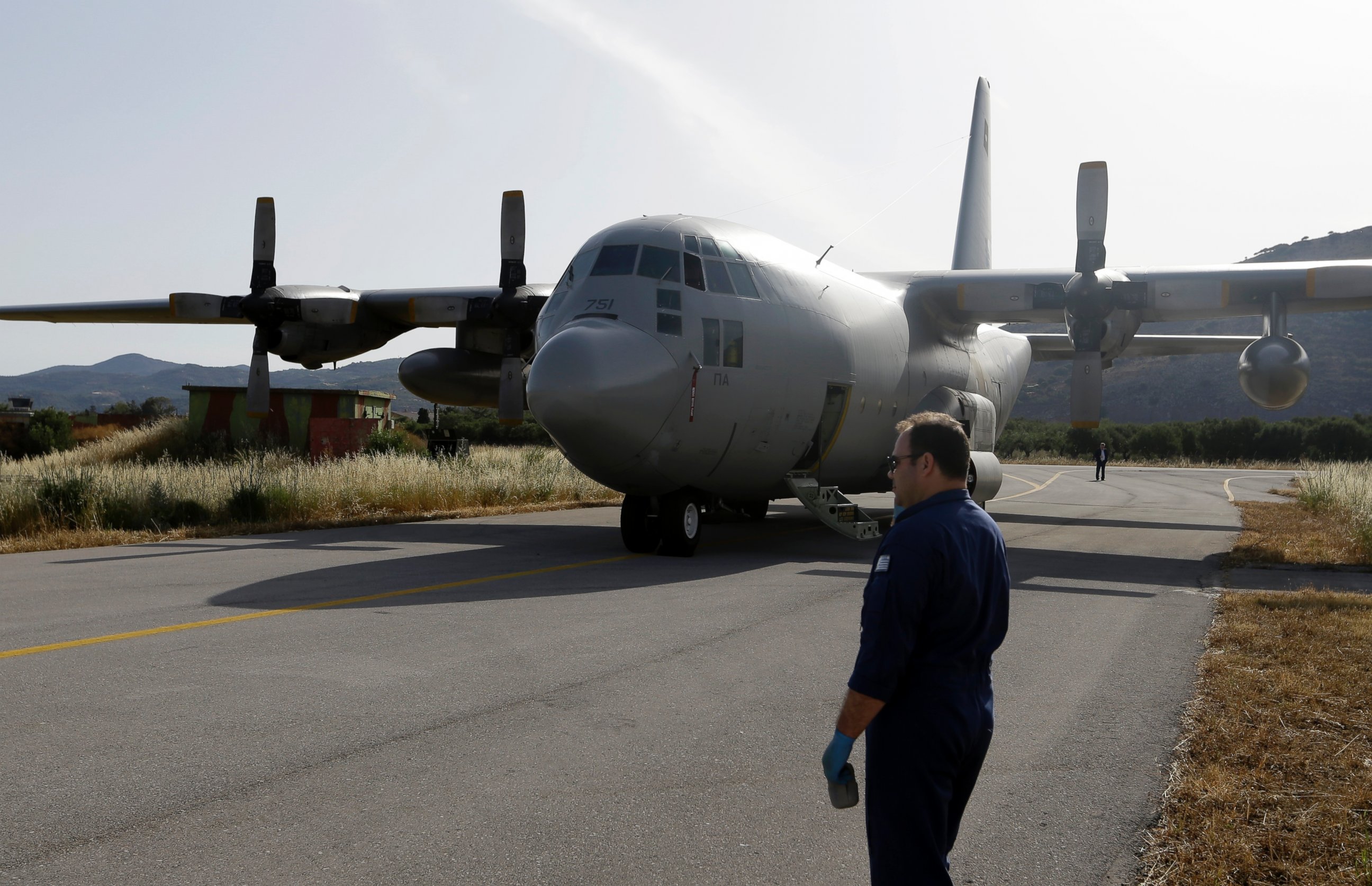 PHOTO: An engineer stands in front of a C-130 HAUP of the Hellenic Air Force, which took part in the searching operation of the missing Egypt plane, at the military air base of Kastelli on the southern Greek island of Crete, May 20, 2016.