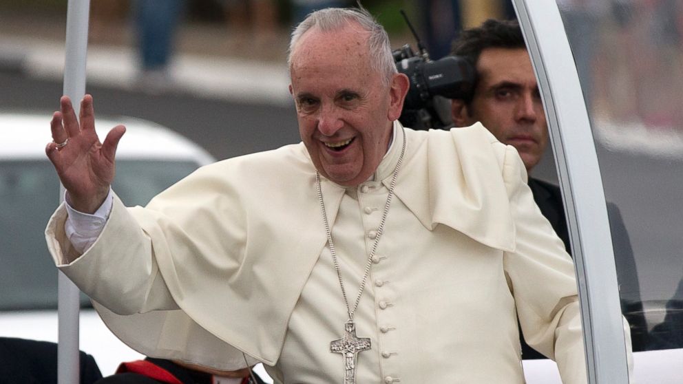 Pope Francis waves from his popemobile as he leaves the airport and arrives to Havana, Cuba, Saturday, Sept. 19, 2015. Pope Francis began his 10-day trip to Cuba and the United States, embarking on his first trip to the onetime Cold War foes after helping to nudge forward their historic rapprochement.