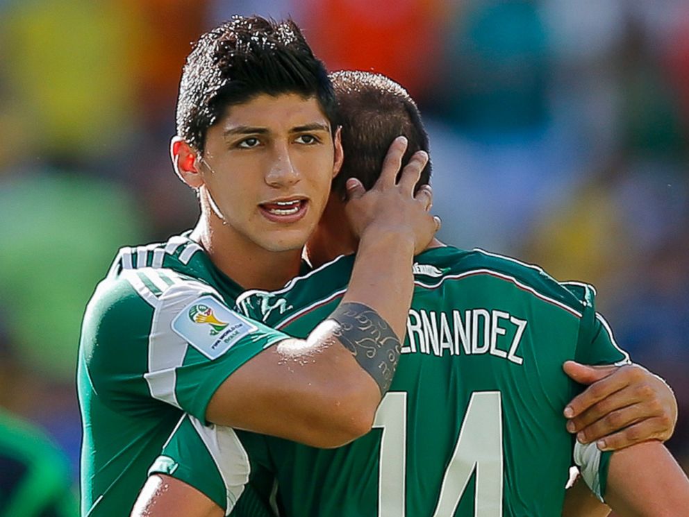 PHOTO: In a June 29, 2014 file photo, Mexico's Alan Pulido seen with Javier Hernandez after the Netherlands defeated Mexico 2-1 during the World Cup round of 16 soccer match between the Netherlands and Mexico at the Arena Castelao in Fortaleza, Brazil.