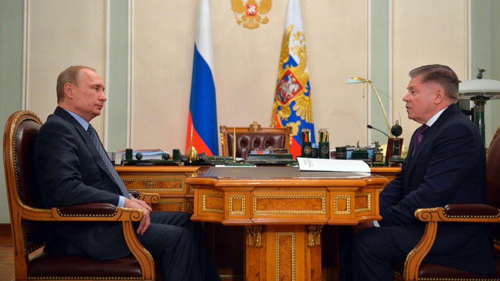 PHOTO: Russian President Vladimir Putin listens to the Supreme Court Chairman Vyacheslav Lebedev, right, in the Novo-Ogaryovo residence outside Moscow, Russia, March 13, 2015.
