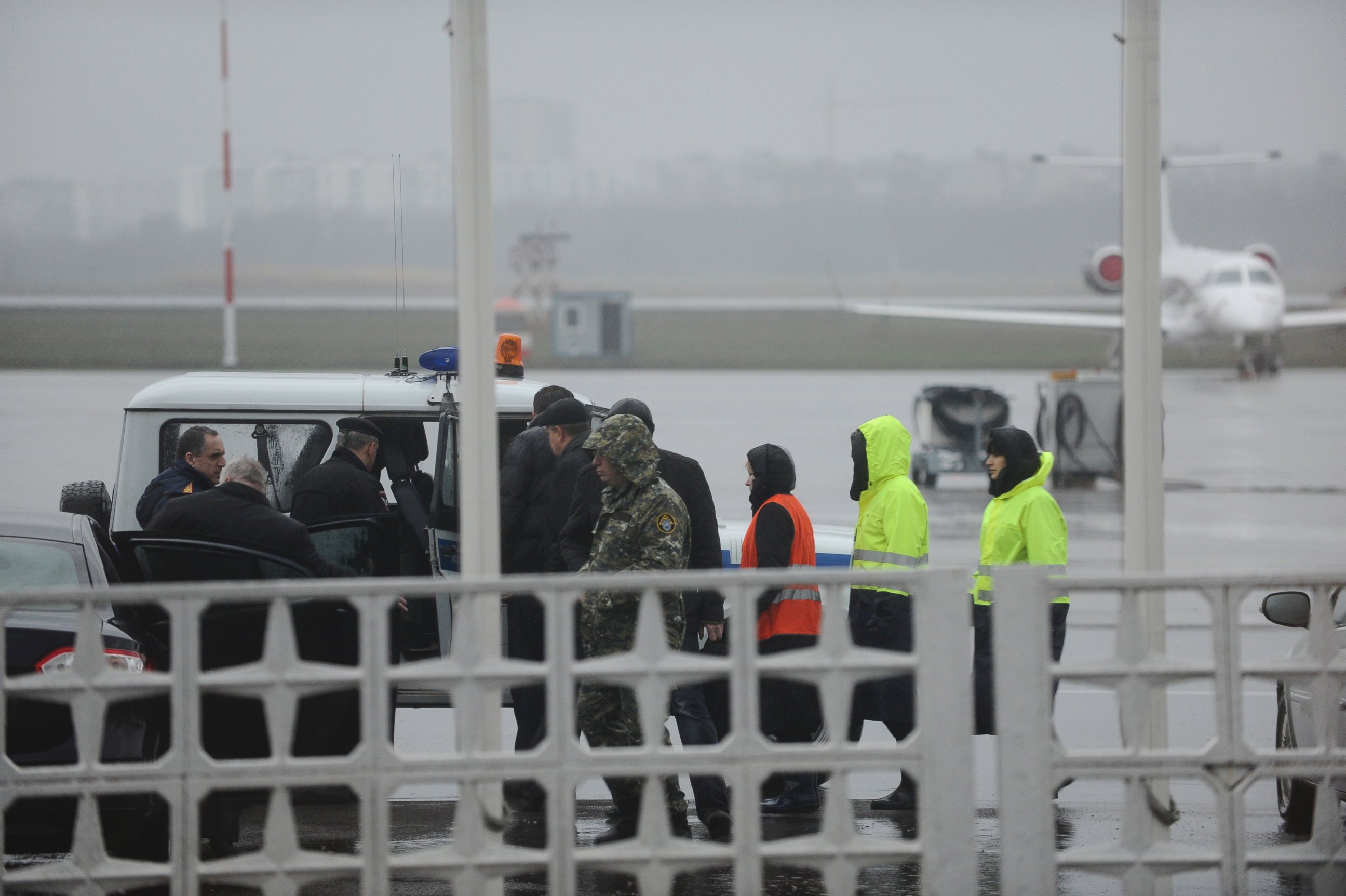 PHOTO: Russian Emergency Situations Ministry employees and police officers are seen as they take a car to drive to the area of the FlyDubai flight 981 crash site at the Rostov-on-Don airport on Saturday, March 19, 2016. 