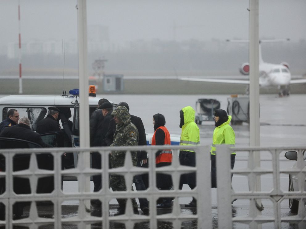 PHOTO: Russian Emergency Situations Ministry employees and police officers are seen as they take a car to drive to the area of the FlyDubai flight 981 crash site at the Rostov-on-Don airport on Saturday, March 19, 2016.