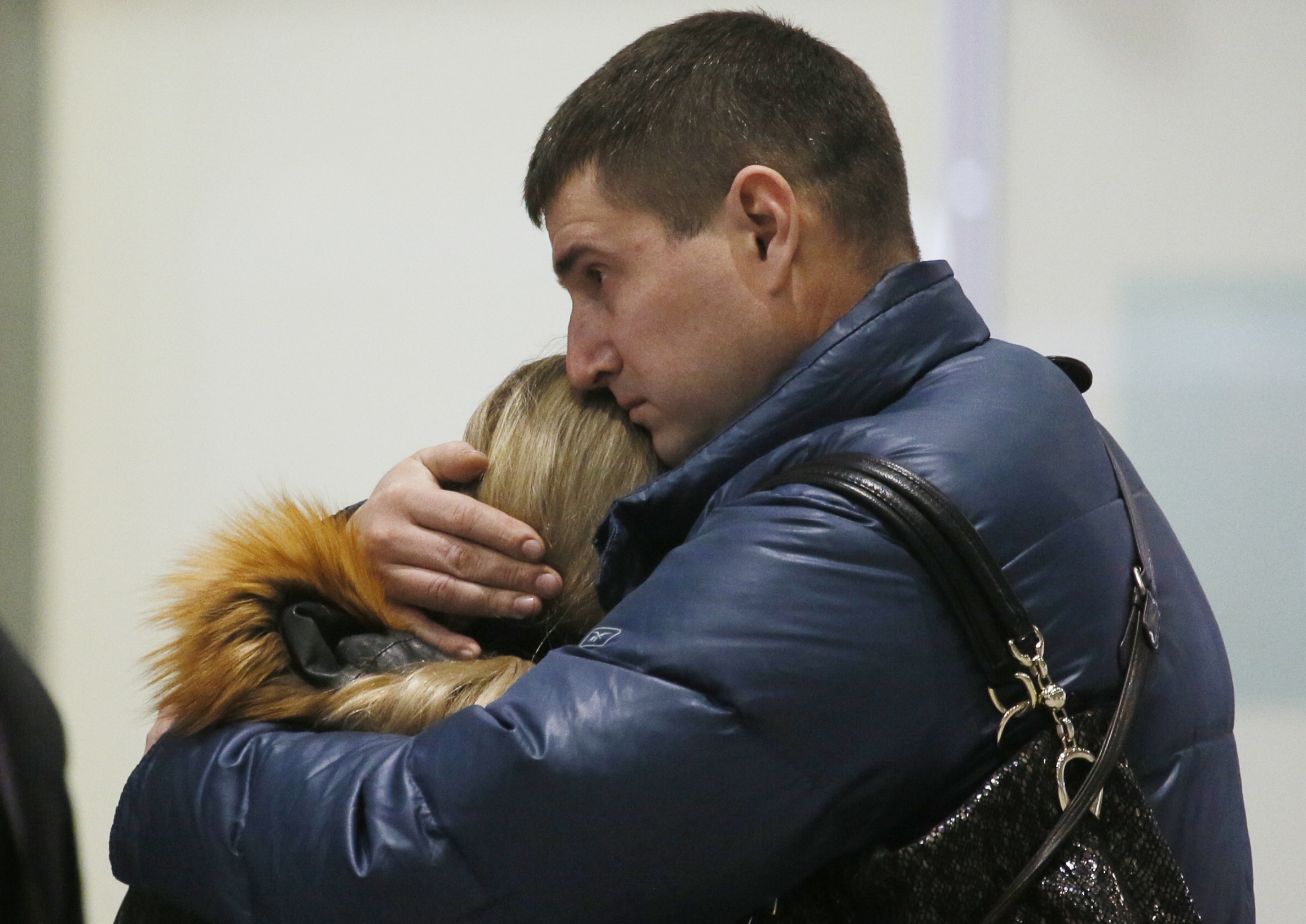 PHOTO: Relatives react after a Russian airliner with 217 passengers and seven crew aboard crashed, as people gather at Russian airline Kogalymavia?s information desk at Pulkovo airport in St.Petersburg, Russia, Saturday, Oct. 31, 2015.