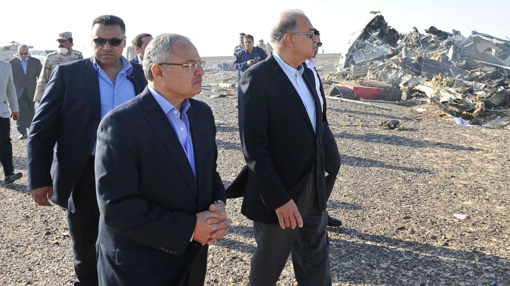 PHOTO: In this photo released by the Prime Minister's office, Sherif Ismail, center, visits the site where a plane crashed in Hassana, Egypt on Saturday, Oct. 31, 2015.