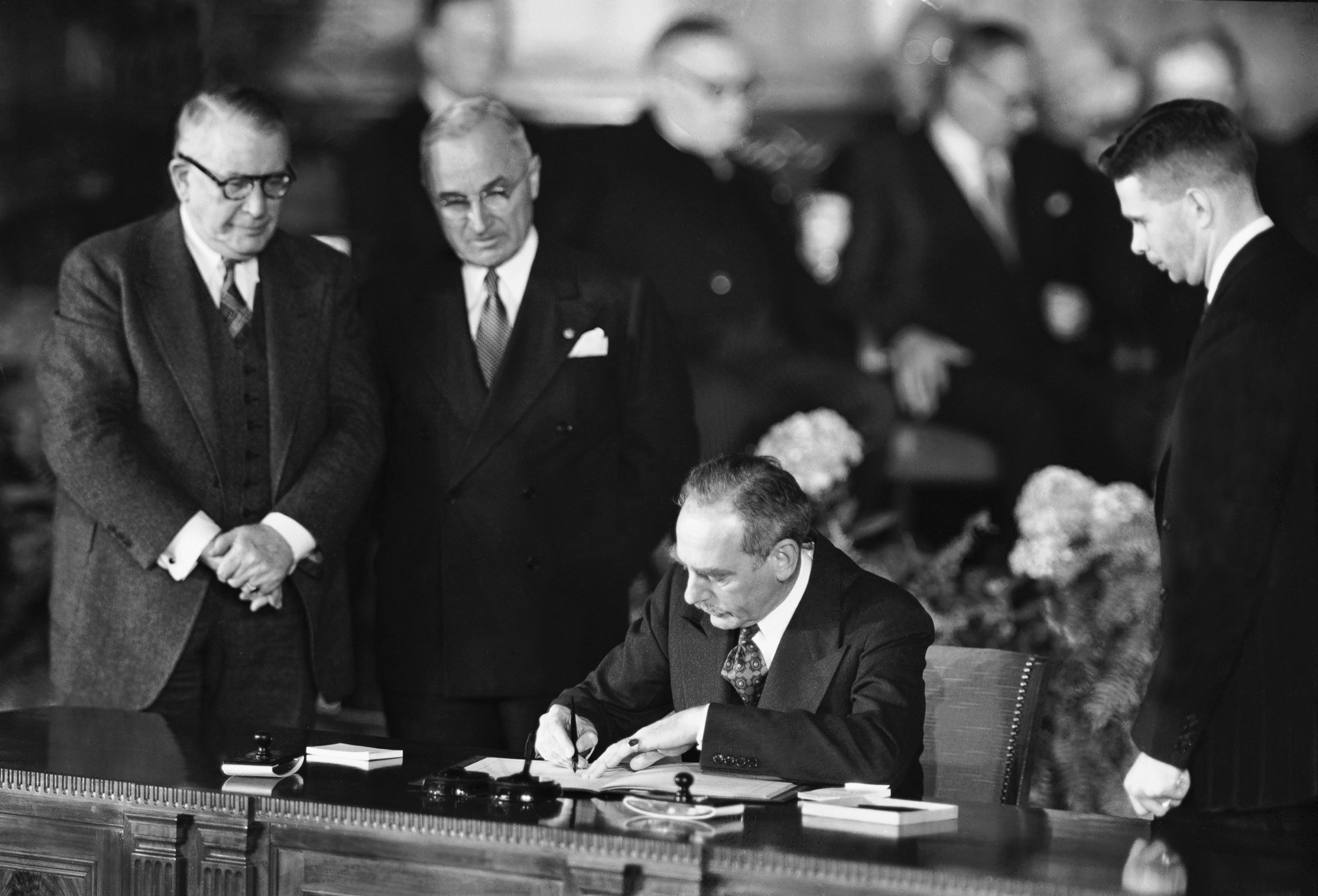 PHOTO: Secretary of State Dean Acheson signs the Atlantic defense treaty for the United States on April 4, 1949. 