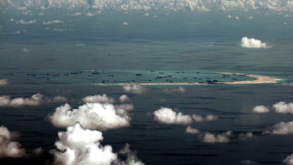 PHOTO: In this May 11, 2015, file photo, this aerial photo taken through a glass window of a military plane shows China's alleged on-going reclamation of Mischief Reef in the Spratly Islands in the South China Sea.