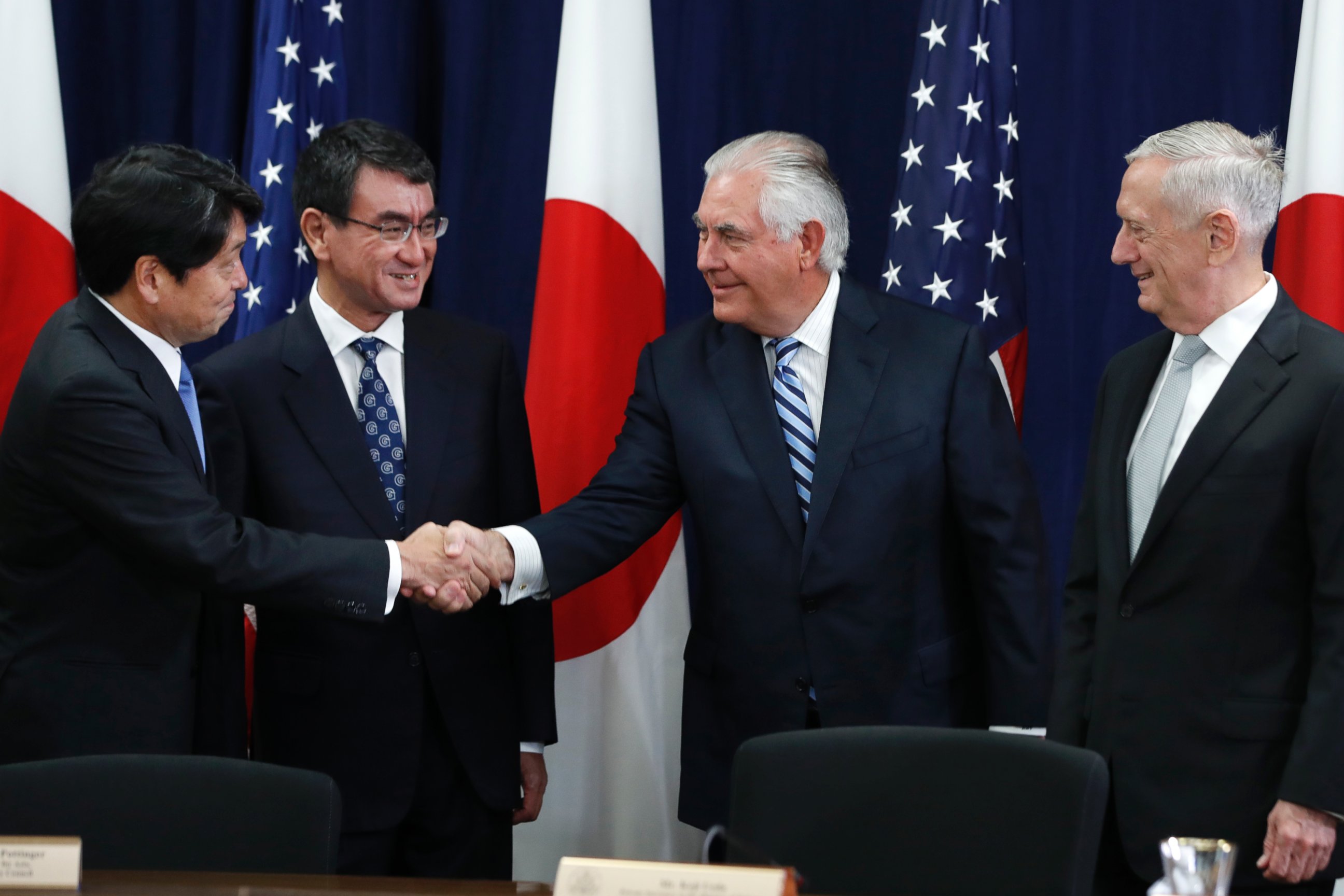 Japanese Defense Minister Itsunori Onodera, left, next to Japanese Foreign Minister Taro Kono, shakes hands with Secretary of State Rex Tillerson, at the start of a Security Consultative Committee meeting, Thursday, Aug. 17, 2017.