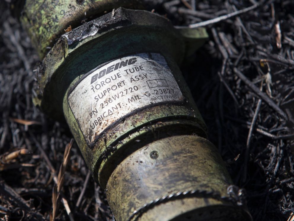 PHOTO: A piece of the crashed Malaysia Airlines Flight 17lies in the grass near the village of Hrabove, Donetsk region in eastern Ukraine, July 21, 2014.