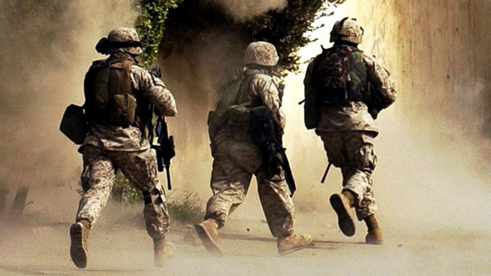 PHOTO: In this Oct. 26, 2004 file photo, U.S. Marines run to a building after detonating explosives in Ramadi, Iraq.  