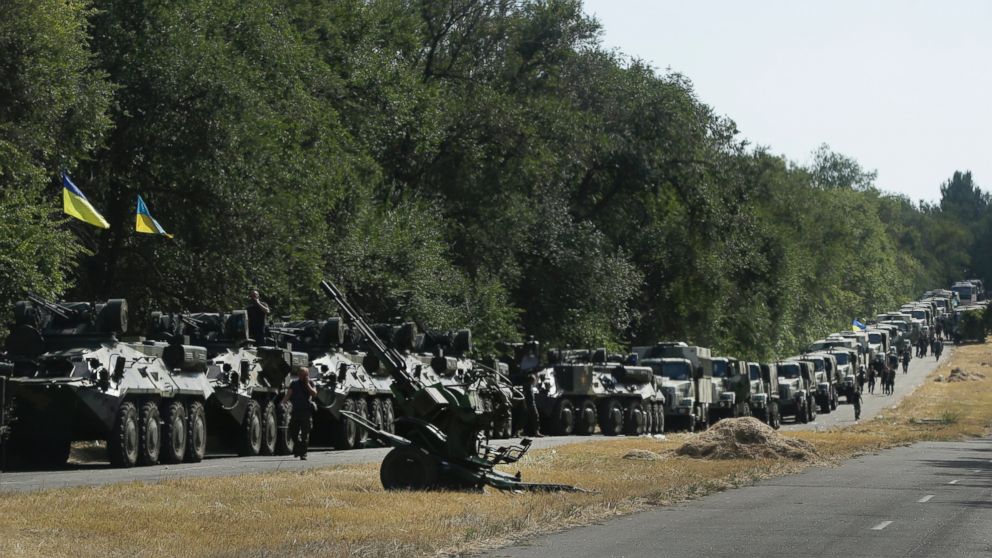 PHOTO: Ukrainian soldiers park their hardware on the roadside as they wait for the start of the march into the town of Mariupol, eastern Ukraine, Aug. 27, 2014. 