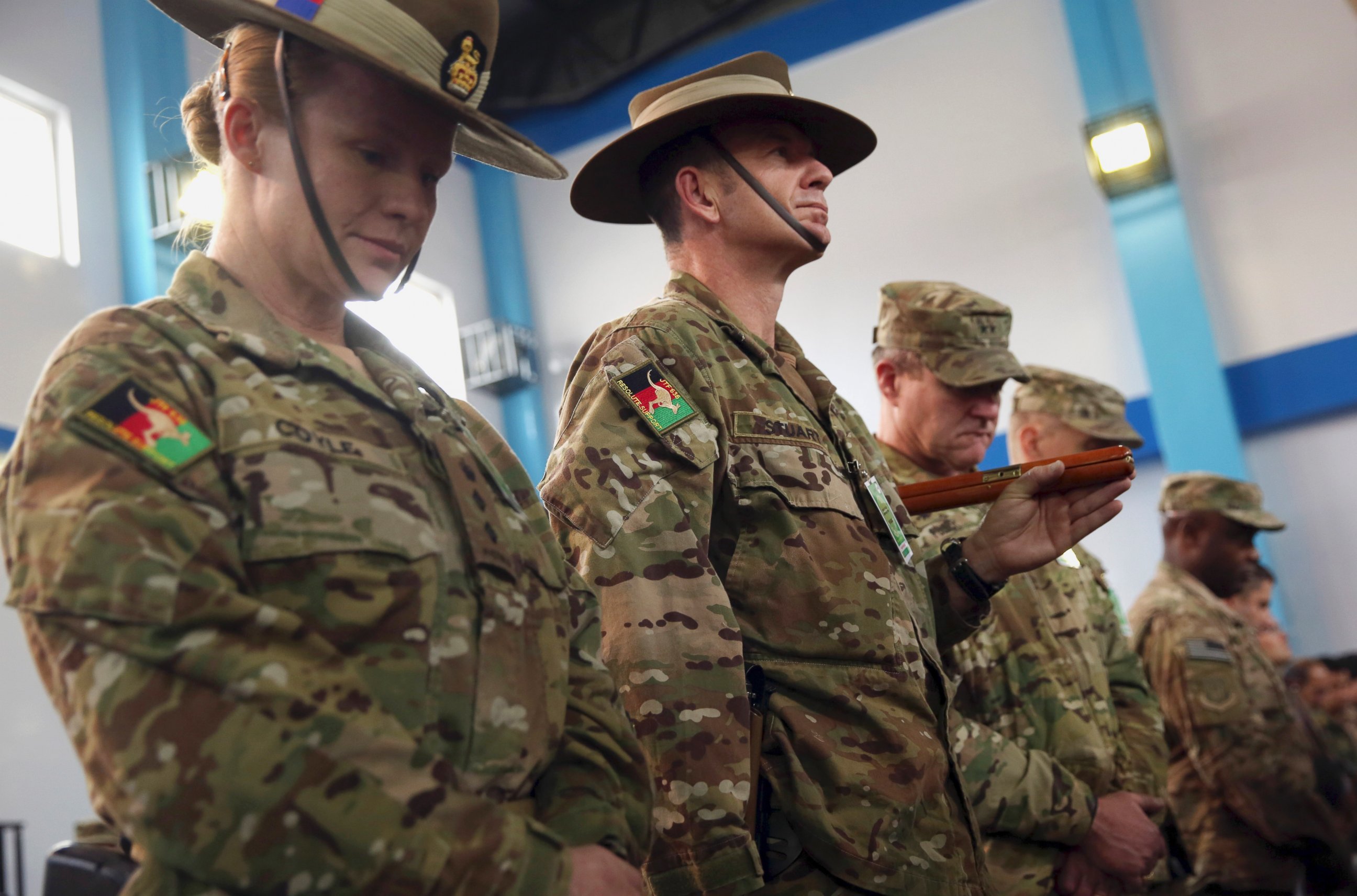 PHOTO: Soldiers for the International Security Assistance Force (ISAF) attend a ceremony at the ISAF headquarters in Kabul, Afghanistan, Sunday, Dec. 28, 2014.