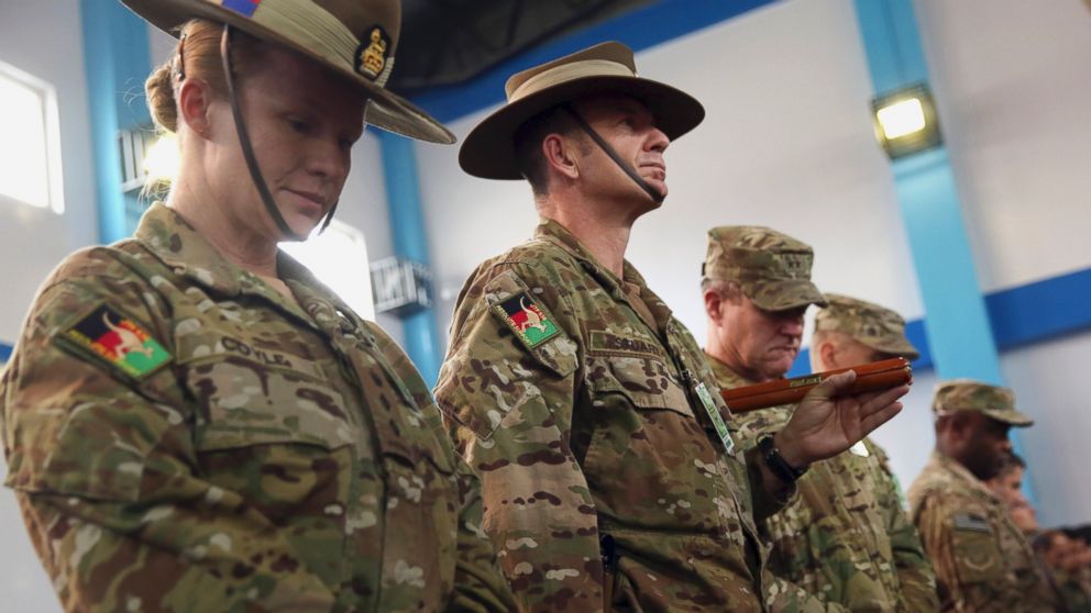 PHOTO: Soldiers for the International Security Assistance Force (ISAF) attend a ceremony at the ISAF headquarters in Kabul, Afghanistan, Sunday, Dec. 28, 2014.
