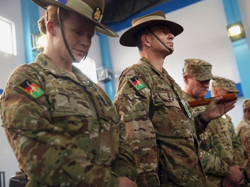 PHOTO: Soldiers for the International Security Assistance Force (ISAF) attend a ceremony at the ISAF headquarters in Kabul, Afghanistan, Sunday, Dec. 28, 2014.
