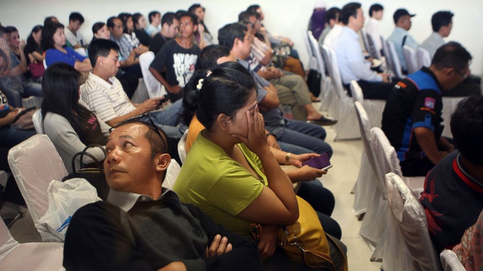 PHOTO: Relatives and next-of-kin of passengers on the AirAsia flight QZ8501 wait for the latest news