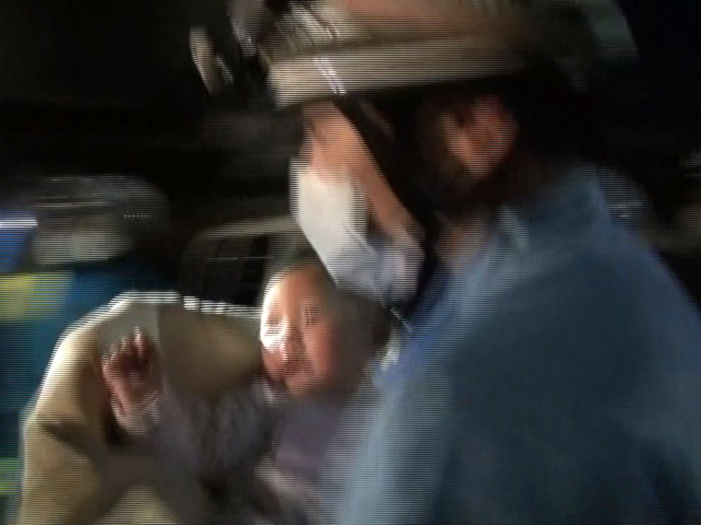 PHOTO: Miku Nishimura, an 8-month-old baby, is carried away by a firefighter after being rescued from a collapsed home after a magnitude-6.5 earthquake in Mashiki town, Kumamoto prefecture, southern Japan, April 15, 2016.