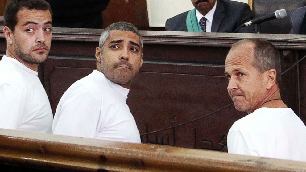 PHOTO: Al-Jazeera English producer Baher Mohamed, left, Canadian-Egyptian acting Cairo bureau chief Mohammed Fahmy, center, and correspondent Peter Greste, right, appear in court along with several other defendants, in Cairo, Egypt, March 31, 2014.