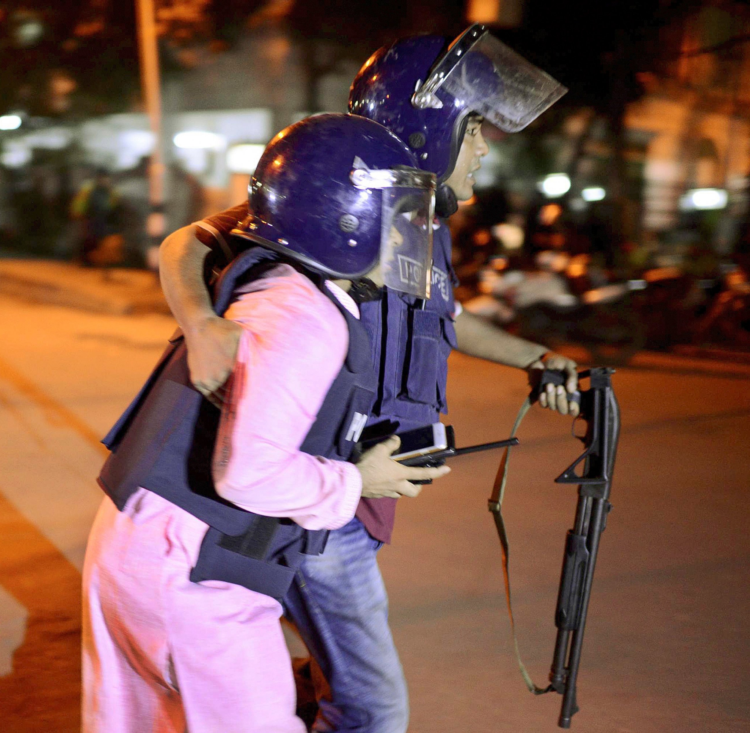 PHOTO: Security personnel is taken for medical attention after a group of gunmen attacked a restaurant popular with foreigners in a diplomatic zone of the Bangladeshi capital Dhaka, Bangladesh, July 1, 2016. 