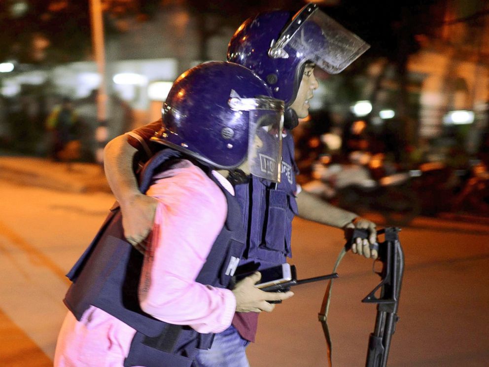 PHOTO: Security personnel is taken for medical attention after a group of gunmen attacked a restaurant popular with foreigners in a diplomatic zone of the Bangladeshi capital Dhaka, Bangladesh, July 1, 2016.