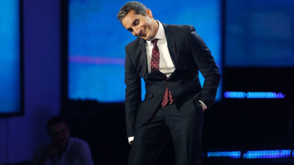 Egyptian satirist Bassem Youssef laughs with journalists during a press conference in Cairo, June 2, 2014.