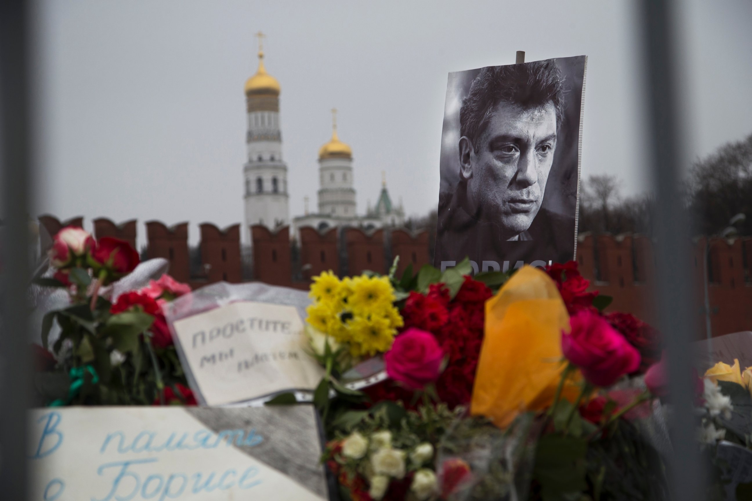 PHOTO: Flowers and a condolence message that reads "In memory of Boris" are placed with a portrait of Boris Nemtsov, at the site where Nemtsov was gunned down near the Kremlin, in Moscow, Russia, Monday, March 2, 2015. 