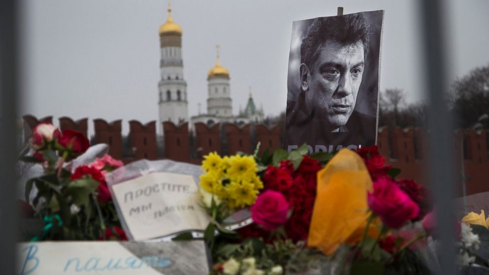 PHOTO: Flowers and a condolence message that reads "In memory of Boris" are placed with a portrait of Boris Nemtsov, at the site where Nemtsov was gunned down near the Kremlin, in Moscow, Russia, Monday, March 2, 2015. 