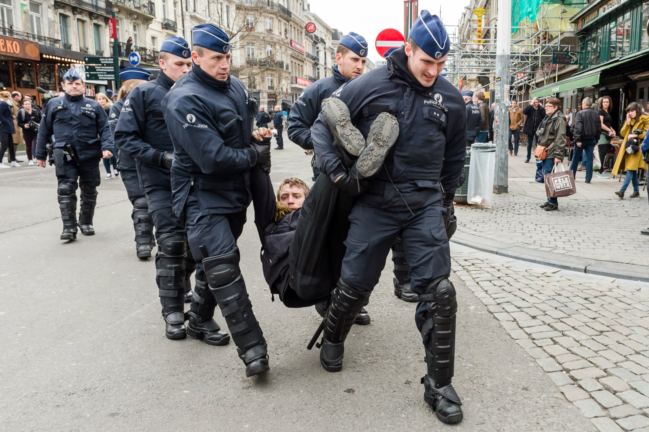 PHOTO: Policemen detain a man at the Place de la Bourse in Brussels, Belgium, April 2, 2016. 