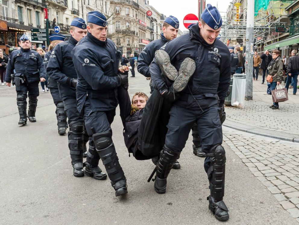 PHOTO: Policemen detain a man at the Place de la Bourse in Brussels, Belgium, April 2, 2016.