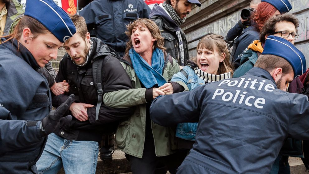 Police detain a group of people at the Place de la Bourse in Brussels, Belgium, April 2, 2016. 