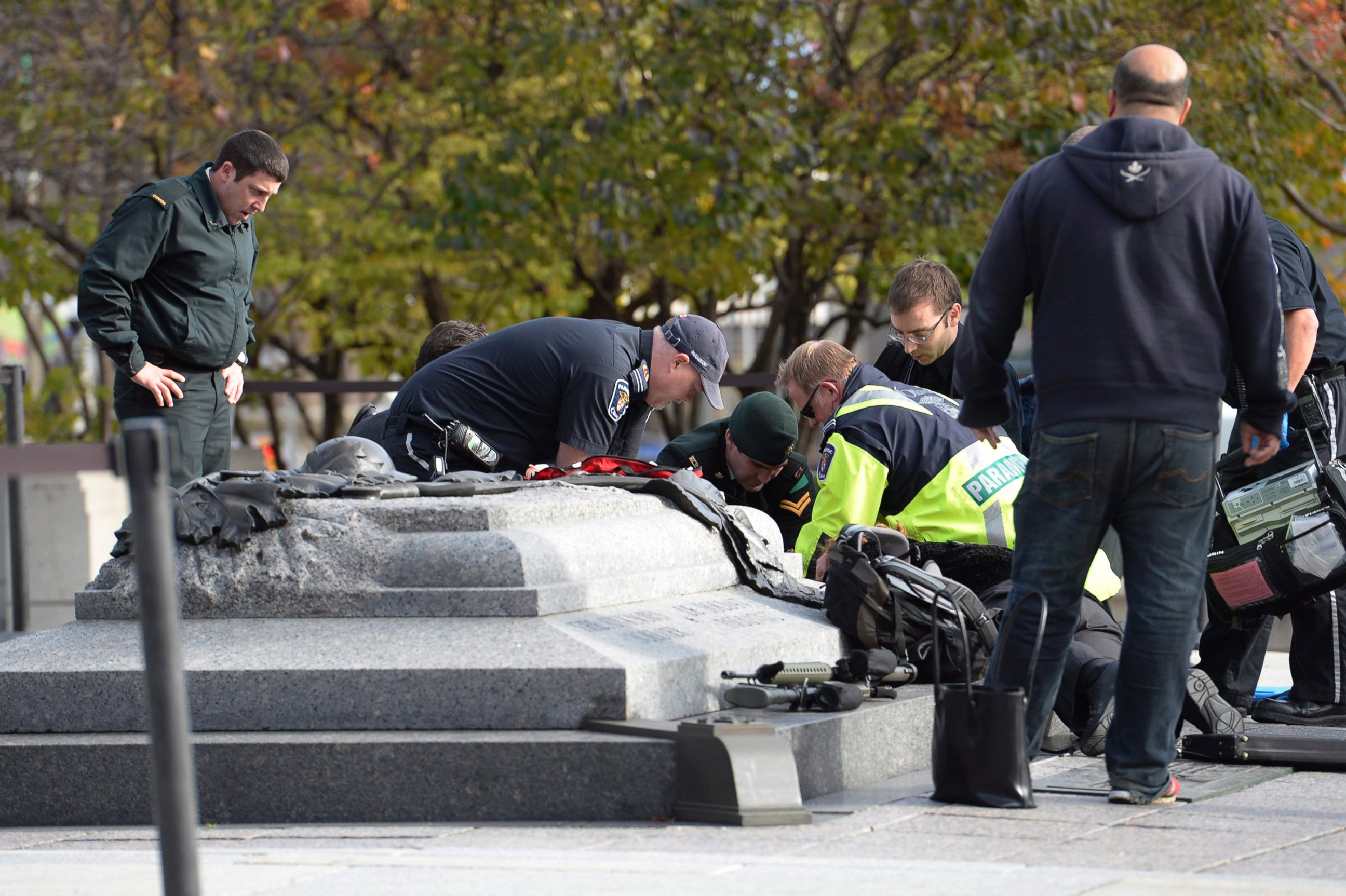 PHOTO: Emergency personnel tend to a soldier shot at the National Memorial near Parliament Hill in Ottawa, Oct. 22, 2014.